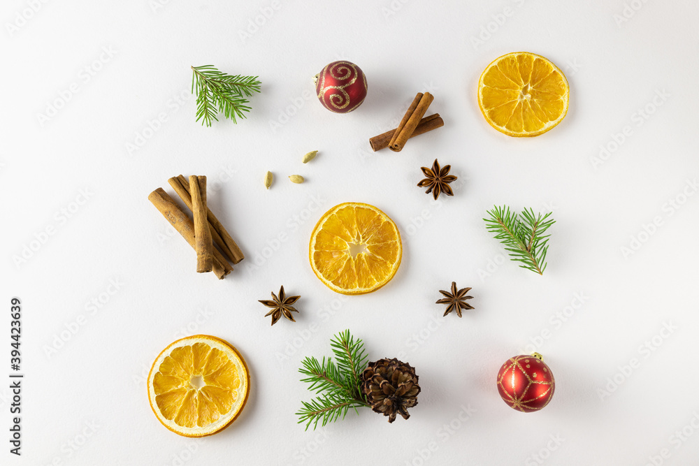 Christmas composition with oranges, fir branches, cinnamon sticks, anise star, cardamom. Flat lay, top view Christmas composition with oranges, fir branches, cinnamon sticks, anise star, cardamom. Flat lay, top view