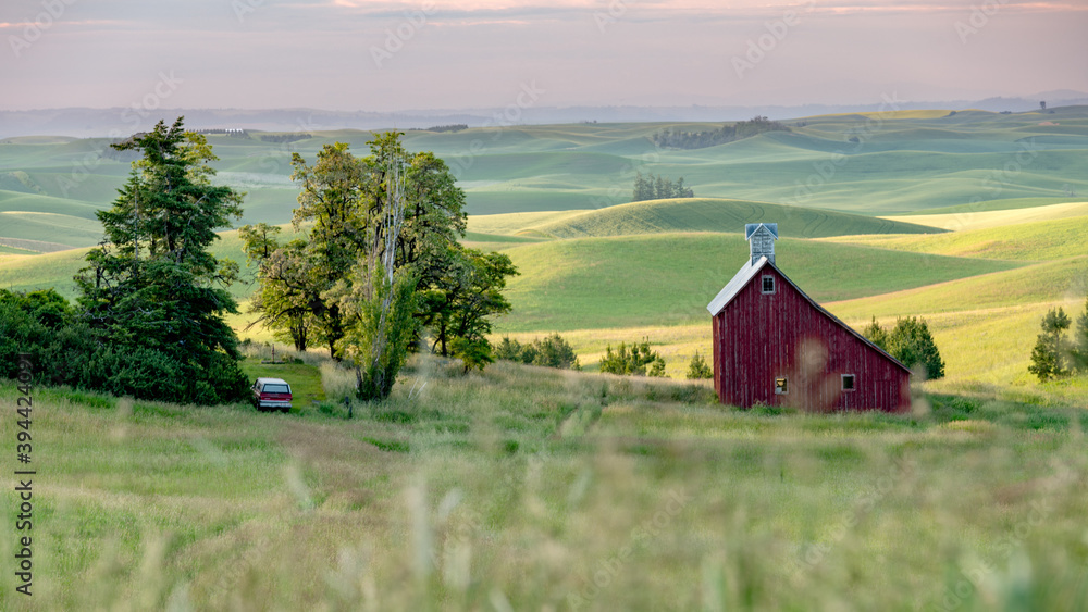 Red barn in the farmland of the Palouse at sunrise Red barn in the farmland of the Palouse at sunrise