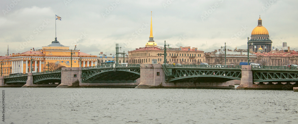 View of the Palace bridge, the Admiralty spire and the dome of St. Isaac's Cathedral from the right Bank of the Neva river.
