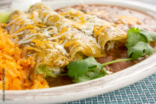 A view of a plate of suiza enchiladas. photo