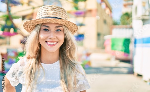 Young caucasian tourist girl smiling happy walking at fairground. © Krakenimages.com