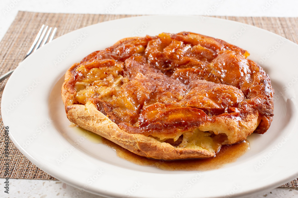A view of an baked apple pancake. A view of an baked apple pancake.