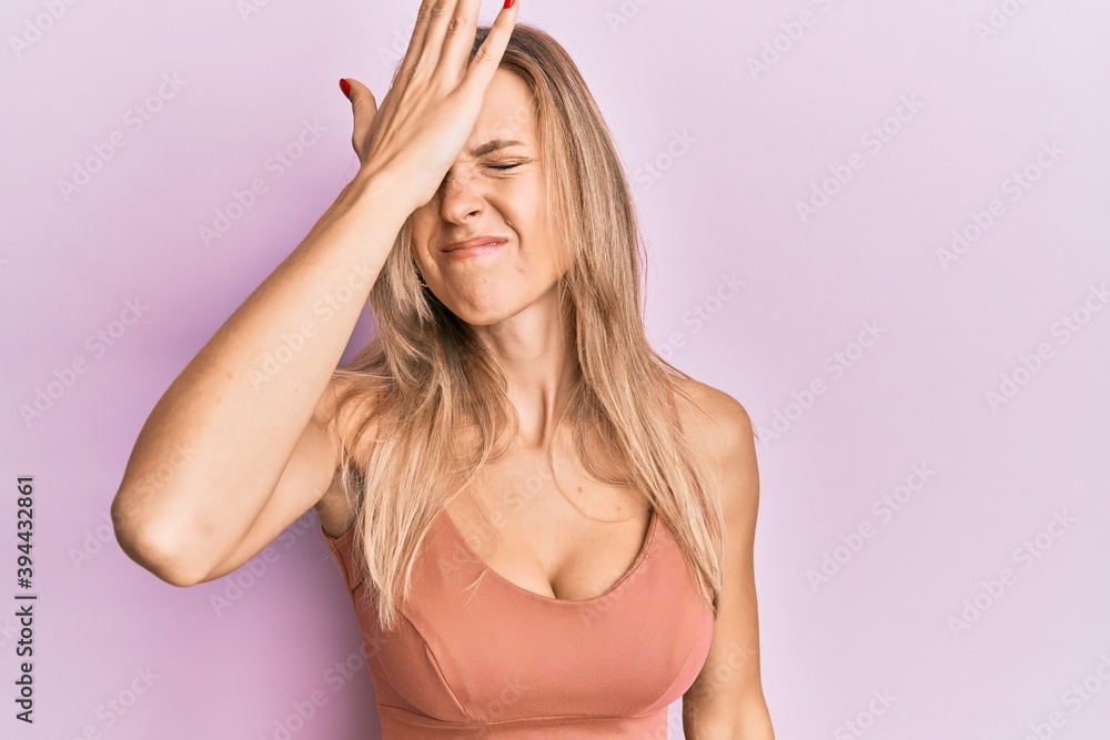 Beautiful caucasian woman wearing casual clothes surprised with hand on head for mistake, remember error. forgot, bad memory concept. Beautiful caucasian woman wearing casual clothes surprised with hand on head for mistake, remember error. forgot, bad memory concept.
