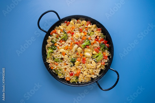 Traditional spanish paella with vegetables and chicken.