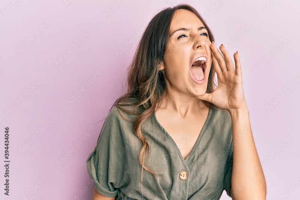 Young brunette woman wearing casual clothes with a happy and cool smile on face. lucky person. Young brunette woman wearing casual clothes with a happy and cool smile on face. lucky person.