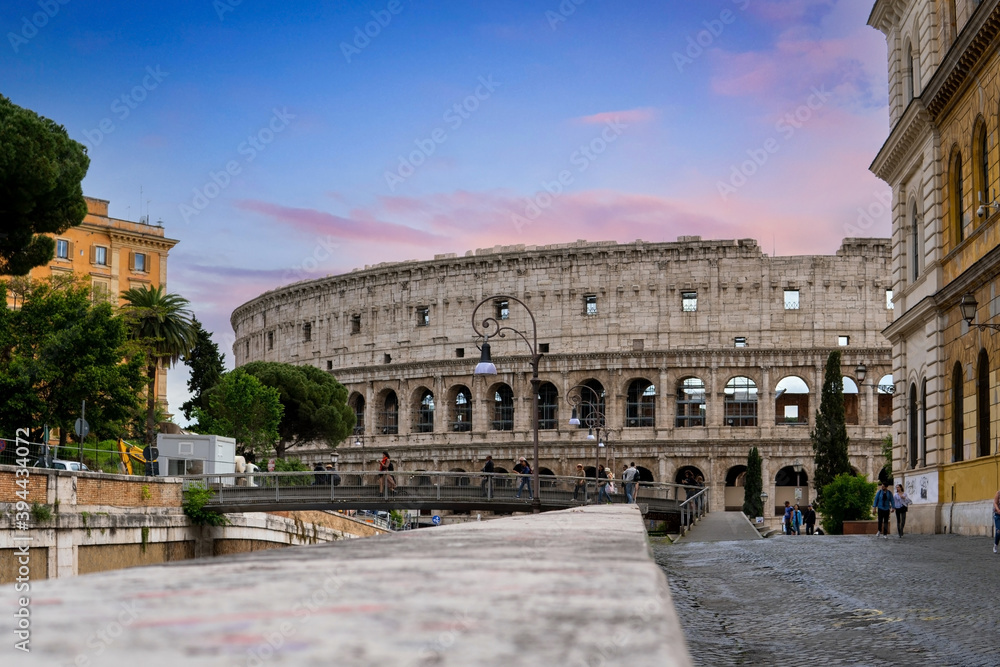 ROME, ITALY - JUNE 29, 2019: Colosseum in Rome, Italy. People visit the famous Colosseum in Roma center.