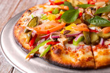 A closeup view of a California vegetarian pizza.
