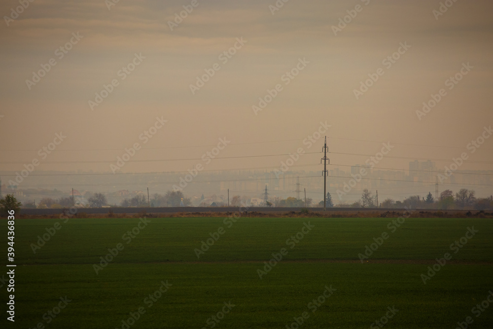 High voltage lines in the morning mist