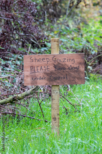 home-made sign telling you Sheep grazing please keep dogs under control