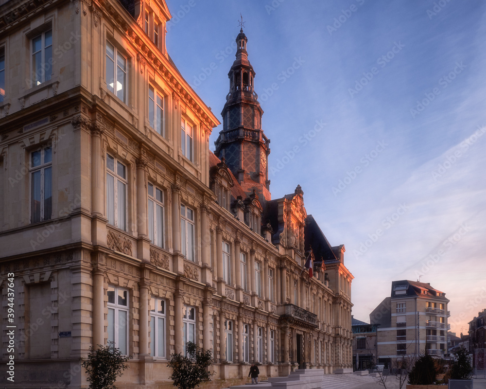 Visit card of Reims Champagne city and its city hall in sunrise light, France