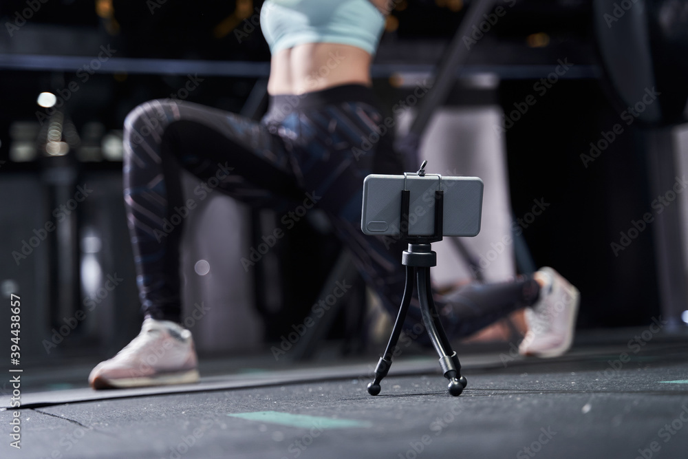 Woman in sportswear practicing lunges Woman in sportswear practicing lunges