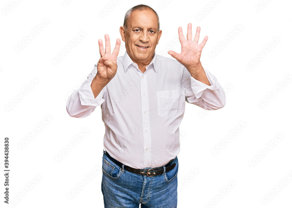 Handsome senior man wearing elegant white shirt showing and pointing up with fingers number eight while smiling confident and happy. Handsome senior man wearing elegant white shirt showing and pointing up with fingers number eight while smiling confident and happy.