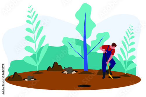 A man looking for some mole that digging a hole in the ground with a shovel