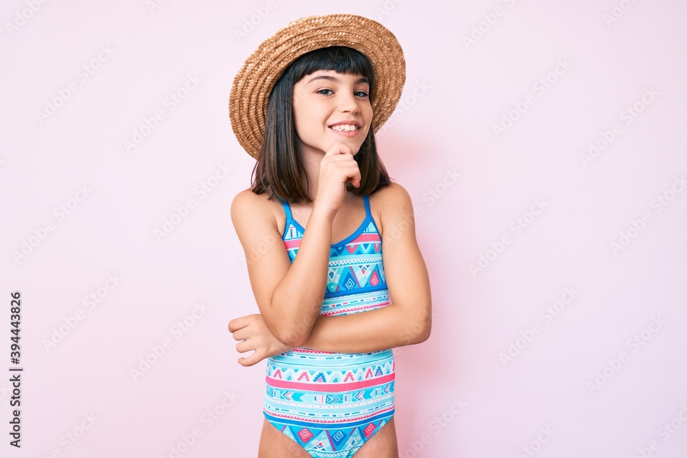 Young little girl with bang wearing swimsuit and summer hat smiling looking  confident at the camera with crossed arms and hand on chin. thinking  positive. Photos | Adobe Stock