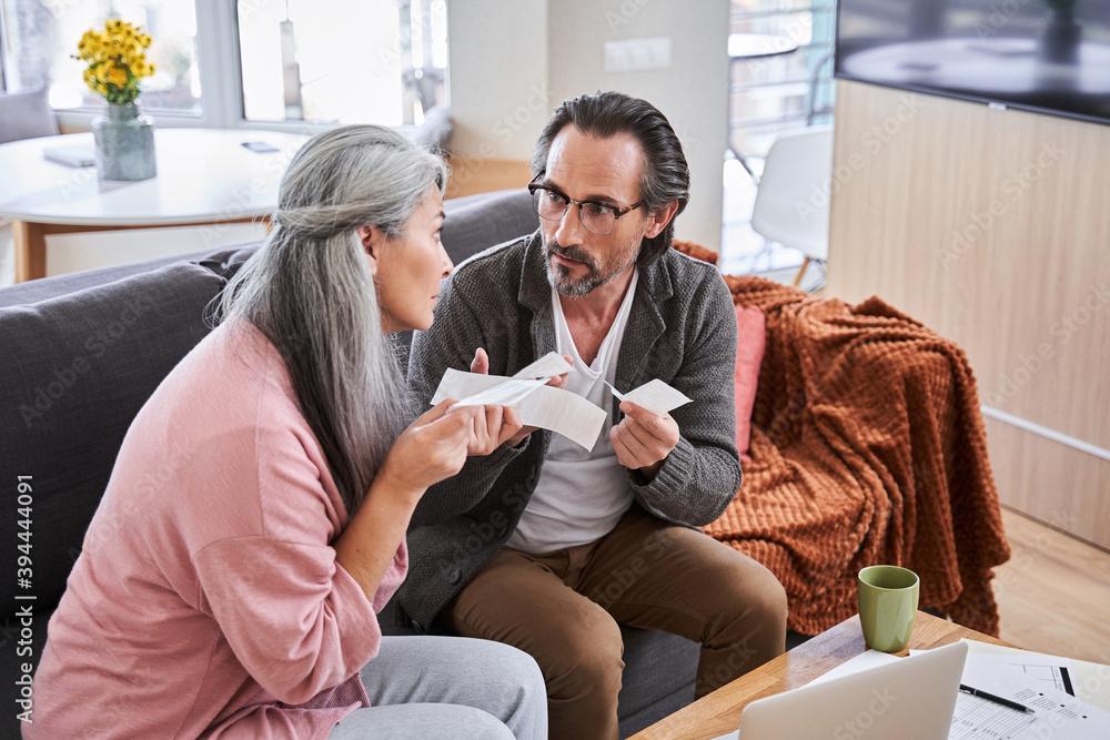 Couple arguing about debt Couple arguing about debt