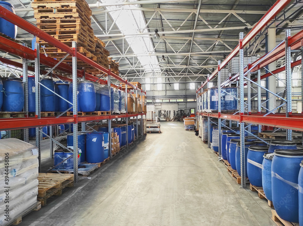 Large modern warehouse with equipment and shelves Large modern warehouse with equipment and shelves