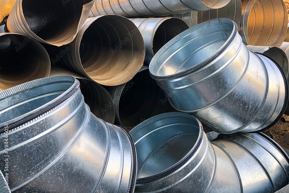 Halvanized ventilation pipe elbows. Industrial metal pipes