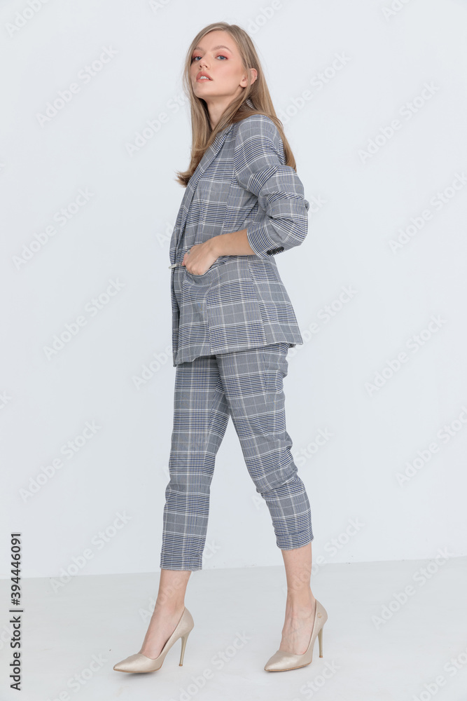 cool fashion model walking and posing in a side view position cool fashion model walking and posing in a side view position