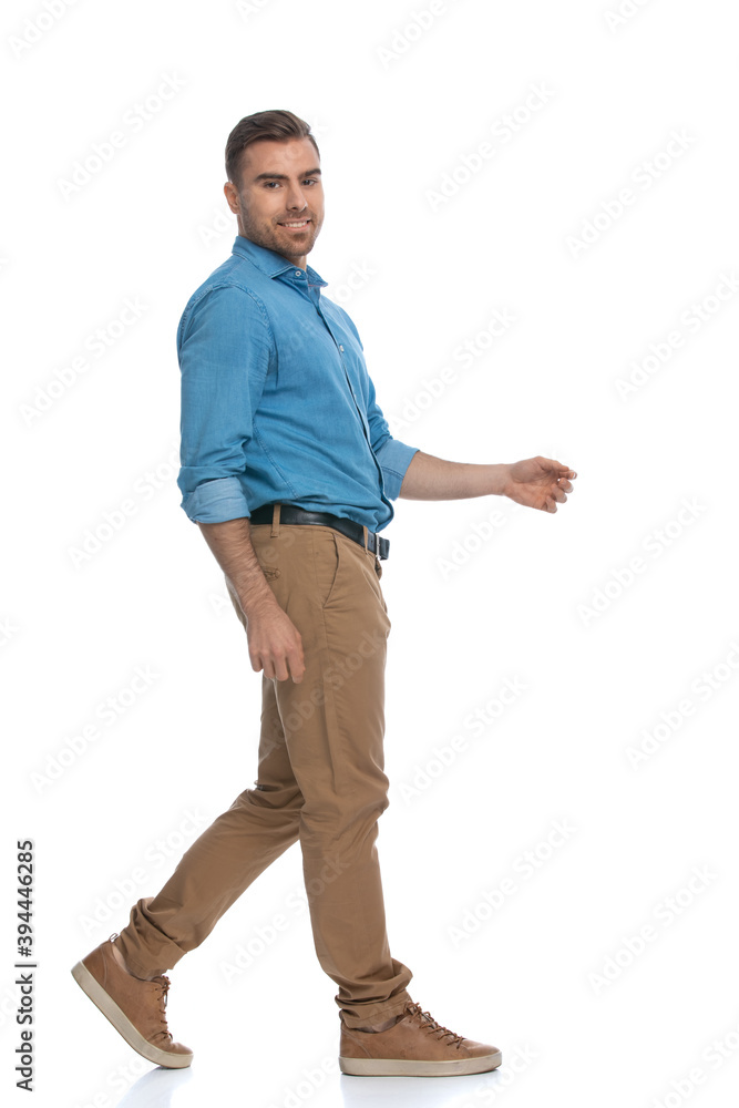 casual man walking one way and looking the other way casual man walking one way and looking the other way