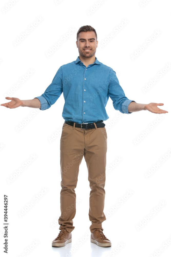 happy casual man greeting someone with open arms happy casual man greeting someone with open arms
