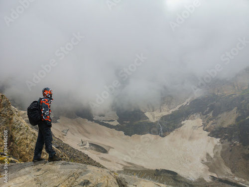 snowy mountains and a mountaineer, hiker man, people, young climber, nature and life 