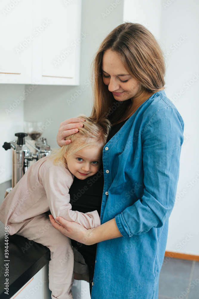Mother and daughter hugging, Sweden Mother and daughter hugging, Sweden