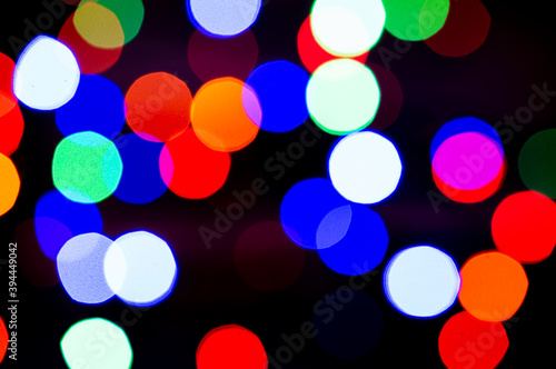 Blurred colored lights garlands. Beautiful Christmas and New Year background.