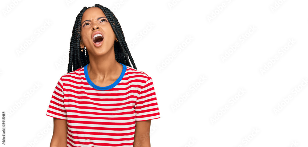 Beautiful hispanic woman wearing casual clothes angry and mad screaming frustrated and furious, shouting with anger. rage and aggressive concept. Beautiful hispanic woman wearing casual clothes angry and mad screaming frustrated and furious, shouting with anger. rage and aggressive concept.