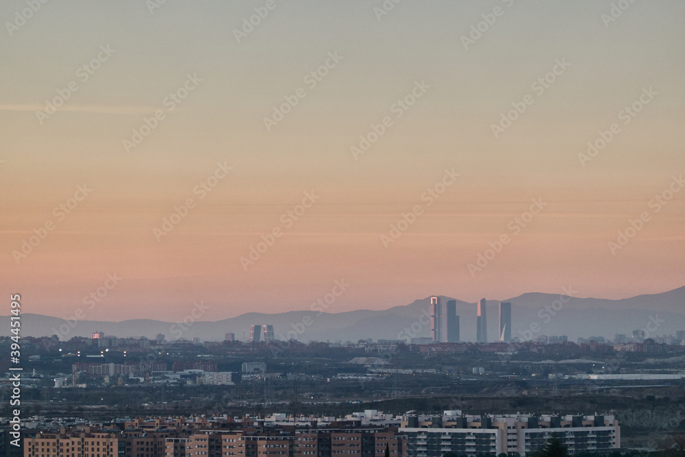 The Madrid Skyline and the Sierra de Guadarrama National Park seen from Cerro del Telégrafo. Madrid's community. Spain