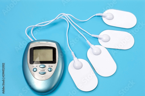 Equipment for electromassage on a blue background