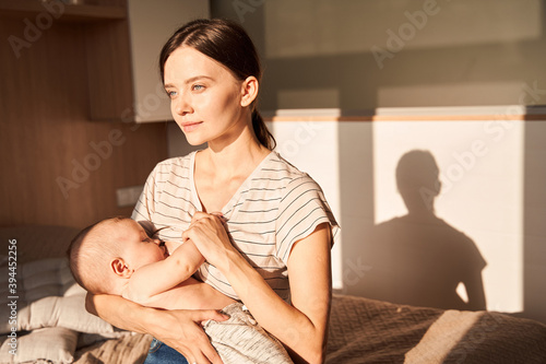Mother breastfeeding her little newborn