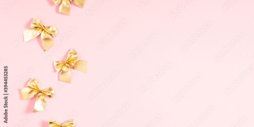 Christmas gold holiday composition. Xmas golden decorations on pink background. Christmas, New Year, winter concept. Flat lay, top view, copy space