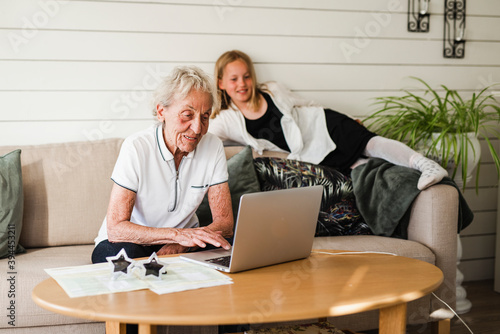 Woman using laptop, Sweden photo