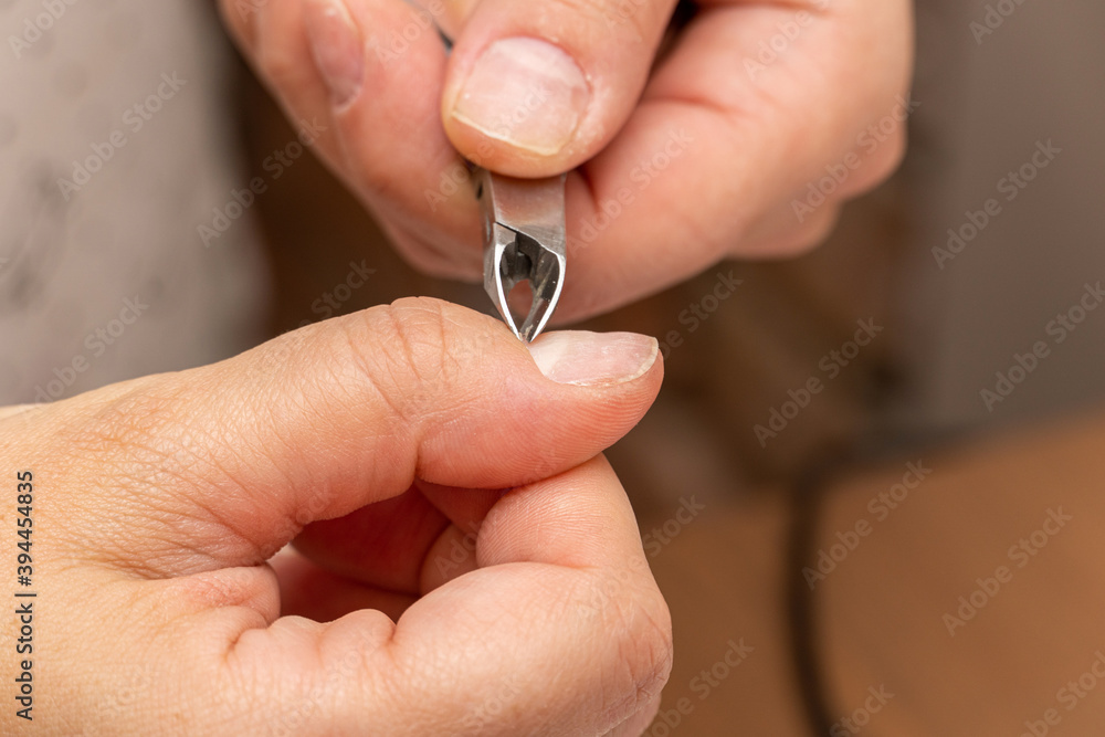 nail cuticle removal with nippers before manicure