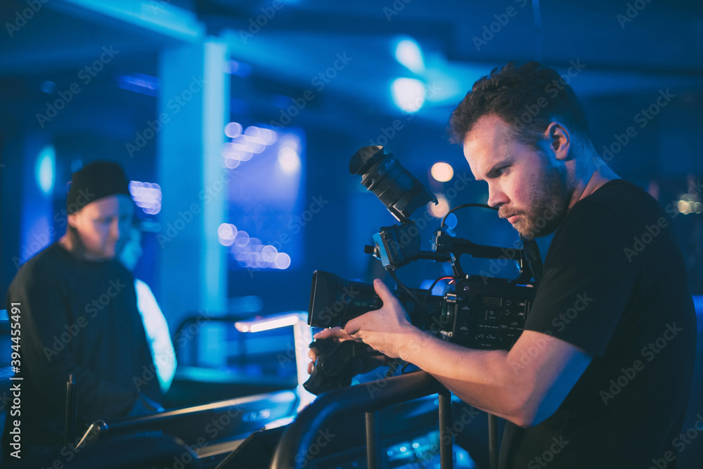 Director of photography with a camera in his hands on the set