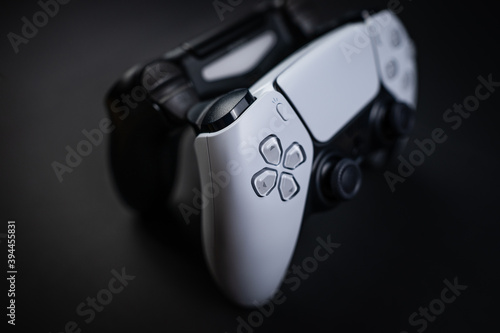 two gaming controller laying side by side