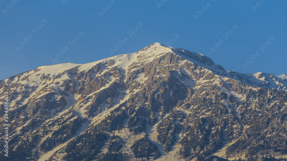 mount top in a swnov on a blue sky background