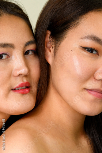 Two Beautiful young Asian women with clean fresh skin on white background, Face care, Facial treatment, Cosmetology, beauty, and spa concept. Mongolian women.