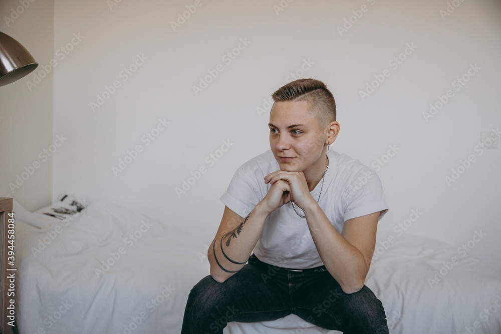Woman sitting on bed, Sweden Woman sitting on bed, Sweden