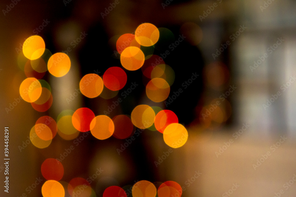 Fototapeta premium Multicolored colorful bokeh lights on abstract dark background.