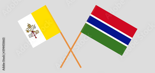 Crossed flags of Vatican and the Gambia