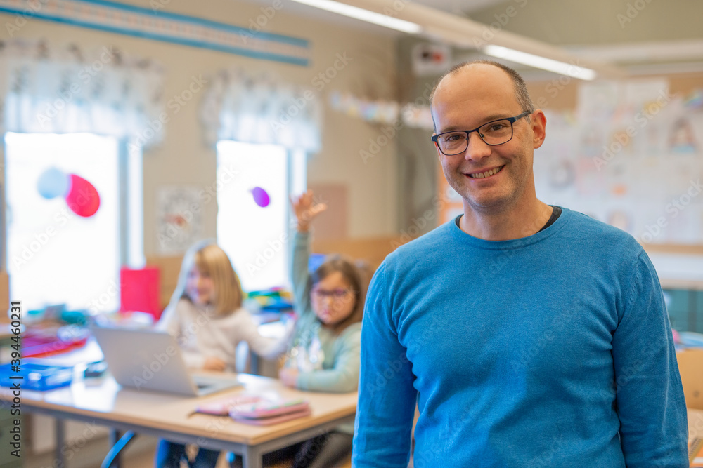 Smiling teacher in classroom, Sweden Smiling teacher in classroom, Sweden