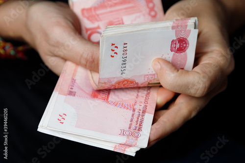 Man counts yuan. Currency of the China - One red hundred renminbi or yuan notes