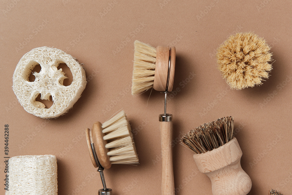 Kitchen Dish Brushes on Isolated Beige Background Side View Copy Space. Little Mug Made from Ecology Clean Nature Material Clay with Eco Clean Bath Accessory Kitchen Dish Brushes on Isolated Beige Background Side View Copy Space. Little Mug Made from Ecology Clean Nature Material Clay with Eco Clean Bath Accessory