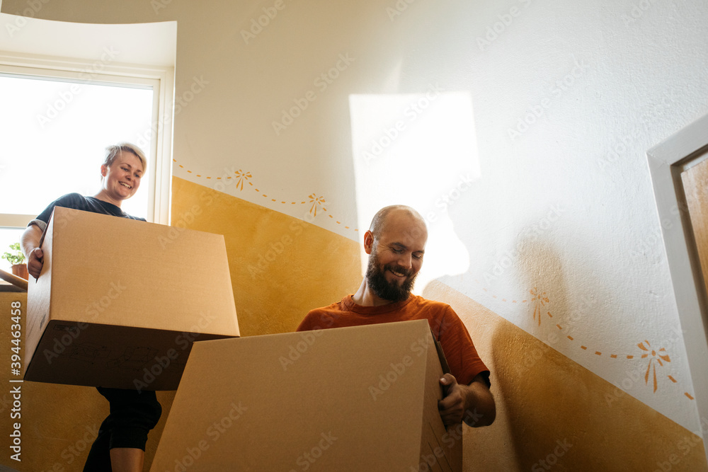 People carrying cardboard boxes at staircase, Sweden People carrying cardboard boxes at staircase, Sweden