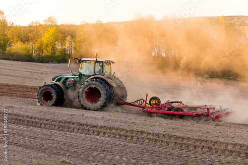 Tractor harrowing field, Sweden
