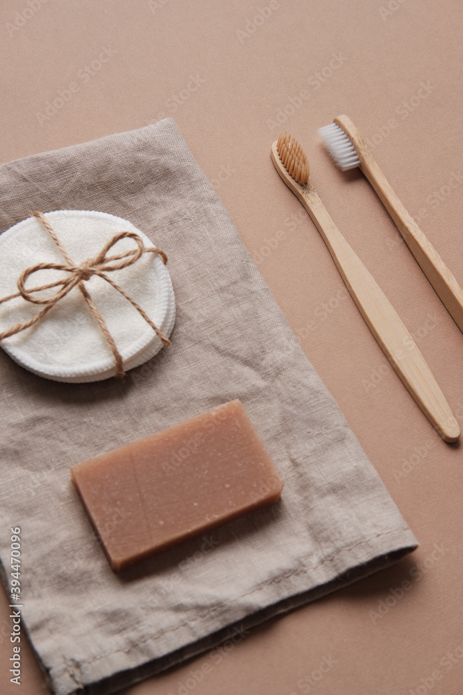 Fototapeta premium Wooden Toothbrush with Natural Soap and Sponge. Zero waste. Tooth Brushes Scattered on Table. Collection of Elegant Ecological Clear Healthcare Bath Accessory for Clean Teeth