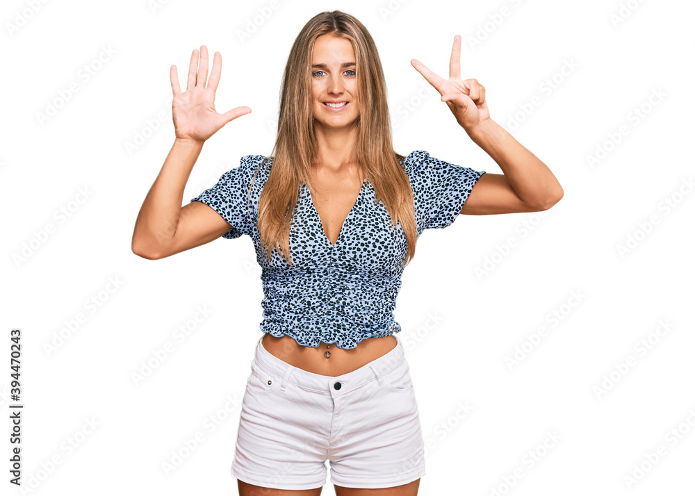 Young blonde woman wearing casual clothes showing and pointing up with fingers number eight while smiling confident and happy. Young blonde woman wearing casual clothes showing and pointing up with fingers number eight while smiling confident and happy.