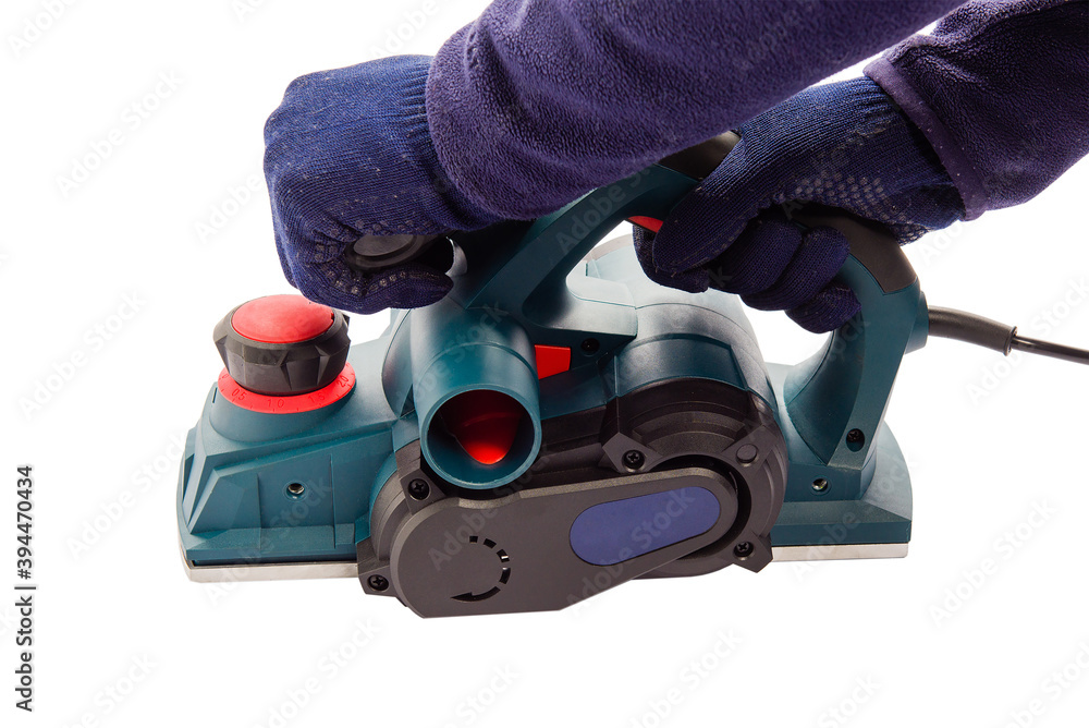 Fototapeta premium Male hands with electric jointer plane