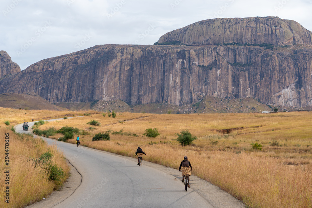 Cyclist on the road in Madagaskar - obrazy, fototapety, plakaty 
